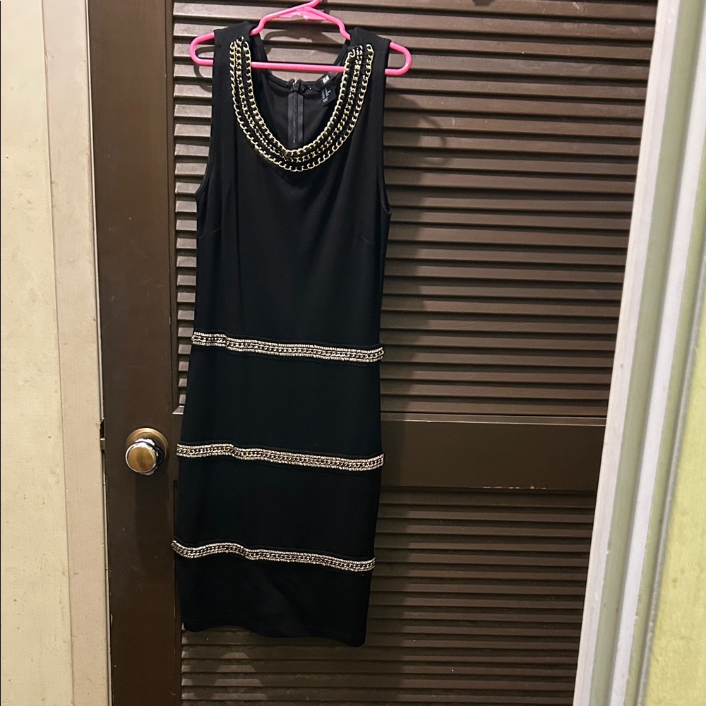 Chic Black Dress with Gold Chain Details